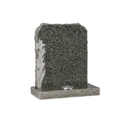 EC68 Green Granite Headstone with rustic edges and hand carved daffodils with natural carved finish.